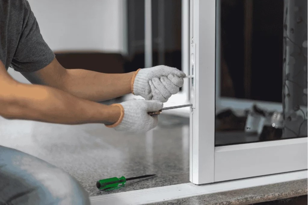 Repairman working on a patio door